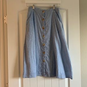 Blue skirt with embroidered white polka dots